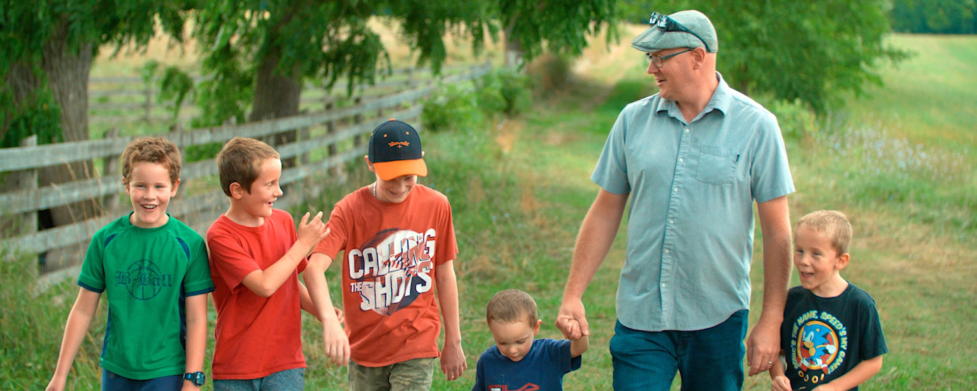 Dad with 5 kids walking in nature