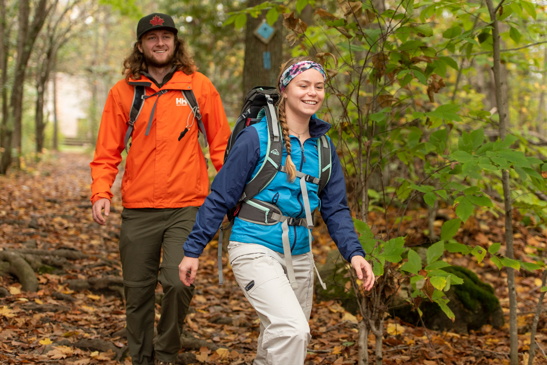 Couple walking at Spirit Rock Conservation Area in fall with leaves on the ground