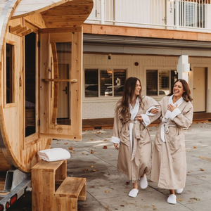 Two people wearing robes at Beach Motel, entering sauna.